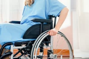 Disabled woman sitting on her wheelchair.