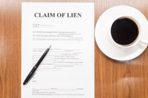 Claim of lien form on the table.