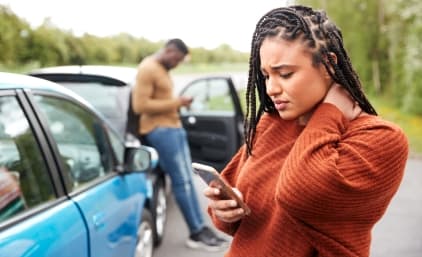 Woman calls a Richmond car accident attorney after a car crash.