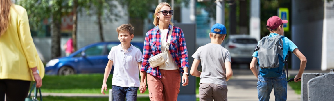 Pedestrians crossing on green signal to walk.