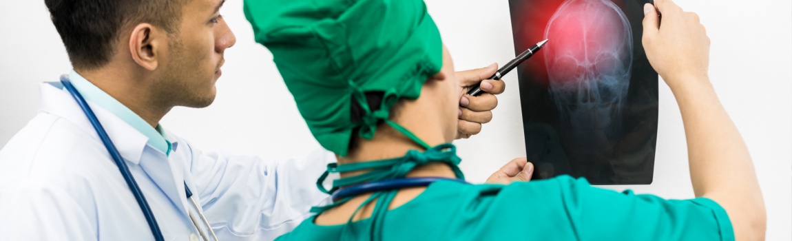 Doctor examining ct scan brain result of an injured patient.