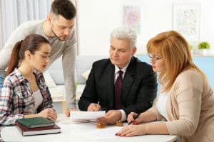 A Richmond brain injury lawyer speaks with his clients.