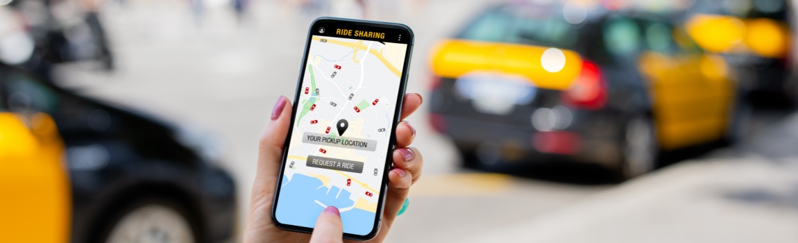 Passenger using rideshare app to book a ride.