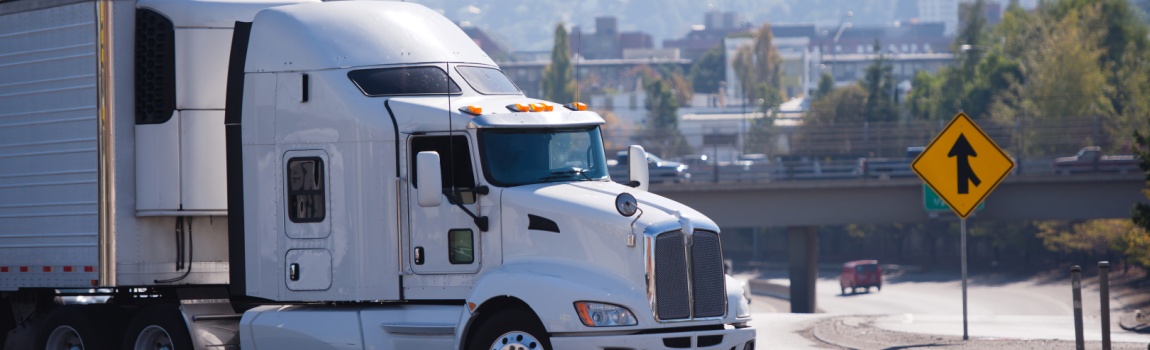 White truck passing the highway.