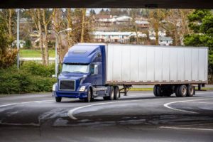 Tractor trailer truck passing under the bridge in Virginia.