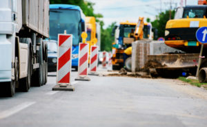 Road work, barricades and warning lights.