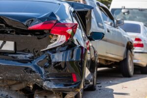 Multiple car collision along the highway.