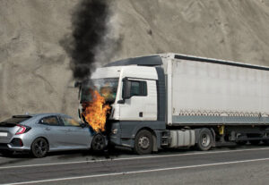 Truck on fire after collision of car.