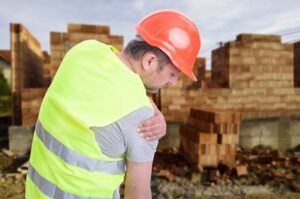 Construction worker suffering from shoulder injury.