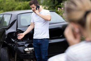 Driver calls insurance to report accident.