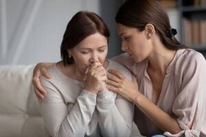 Mother crying on the death of her husband.