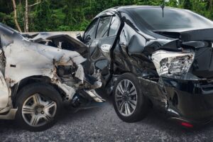 Black car vs silver car crash on the road