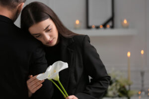 Crying daughter in the funeral.