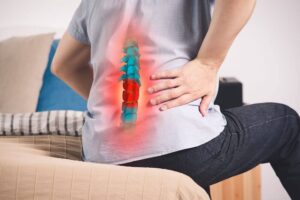 Man suffering back pain and spinal injury from car accident.