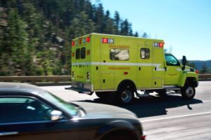 Ambulance passing while car is moving over.