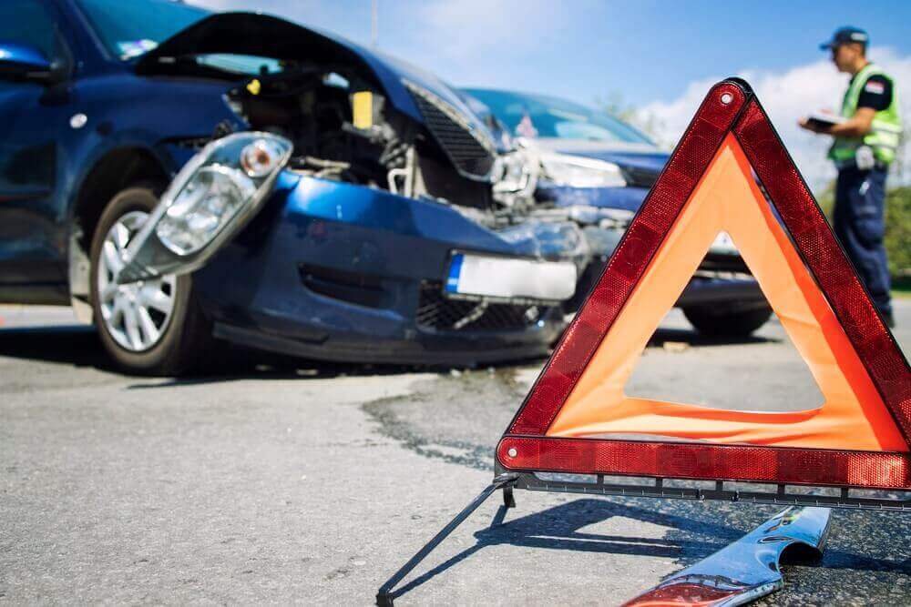 Car collision in intersection with police investigating.