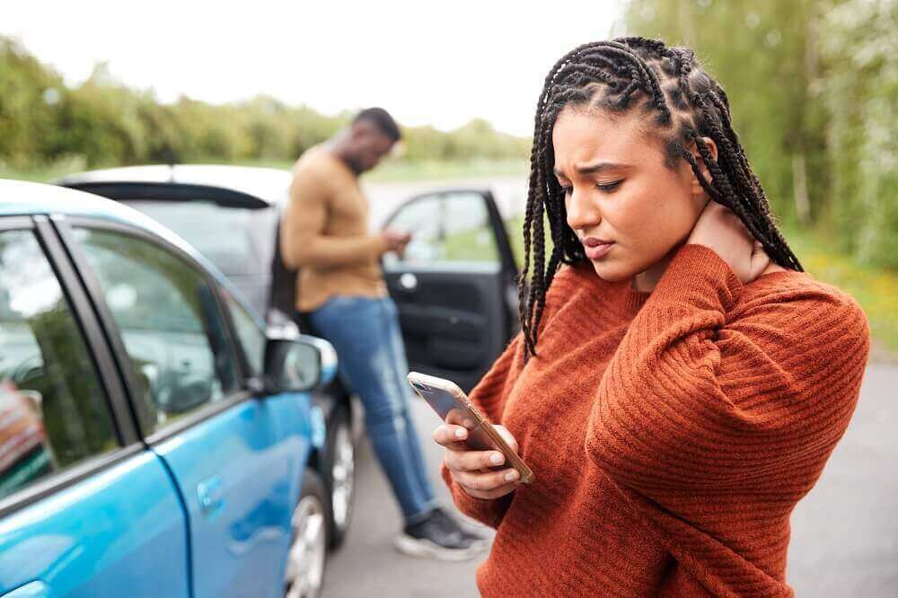 Lady driver injured from accident reporting the accident to her insurance.