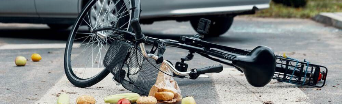 Bicycle vs car collided accident in the street.