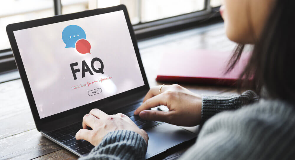 Woman searching for faq in her laptop.